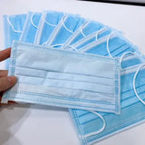 Close-up of 3-ply disposable face mask showing nose pin