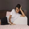 Bed wedge pillow with tapered incline supporting a semi-upright sleeping position