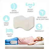 Knee pillow positioned between knees for side-sleeping comfort