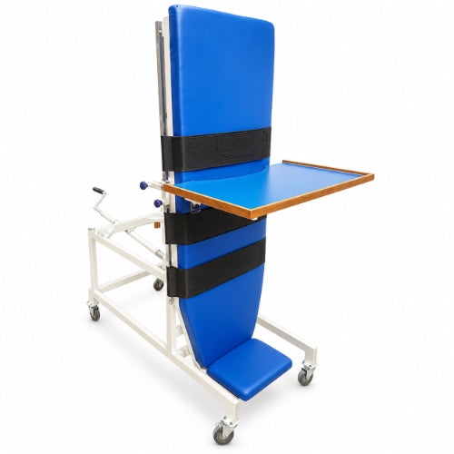 medansh manual tilt table with padded blue surface, securing straps, activity tray, foot support and wheeled steel frame