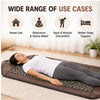 woman using tourmaline magnetic massage mattress at home for relaxation and body comfort