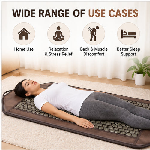 woman using tourmaline magnetic massage mattress at home for relaxation and body comfort